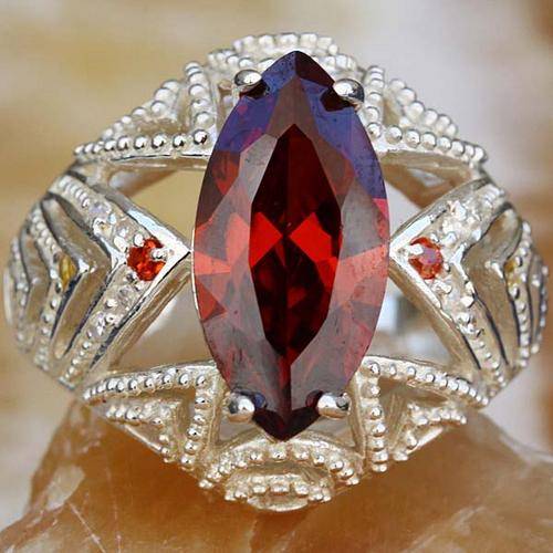 "RAVENOUS RED" RUBY CZ  RING CRAFTED IN  .SILVER