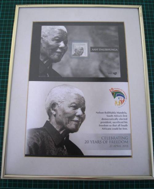 TWO FRAMED MANDELA MEMORABILIA CONTAINING COMMEMORATIVE STAMPS AND COINS