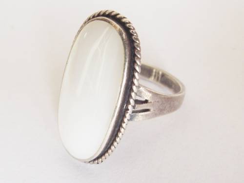 HUGE MOTHER OF PEARL SET IN A STERLING SILVER RING