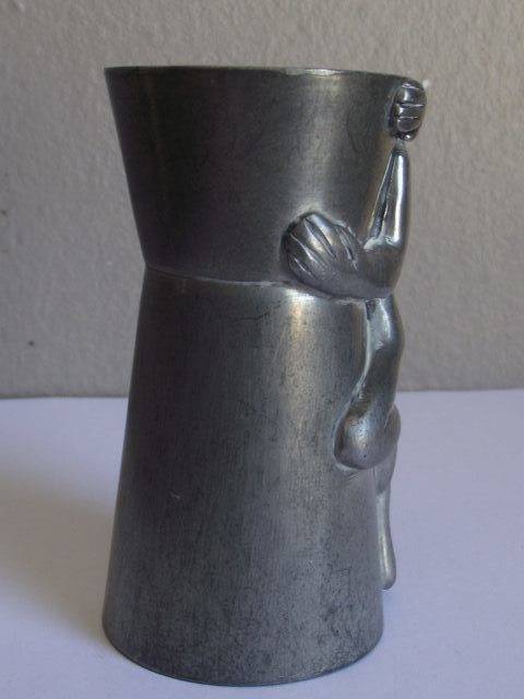 CARROL BOYES MAN DESIGN PEWTER AND ALUMINIUM TOT MEASURE