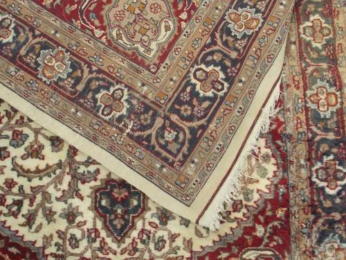 HAND WOVEN PERSIAN CARPET HAS AGE RELATED WEAR