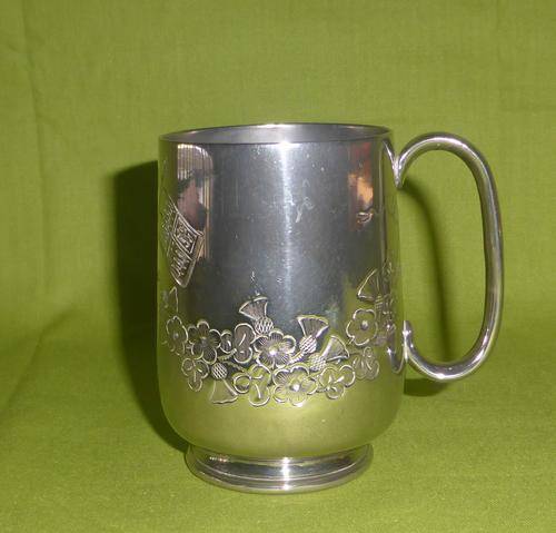 1892 Antique Plated Mug Chased with Flowers, 2 Flags and a Crown (Engraved: F.M.B. 28 FEB 1892)