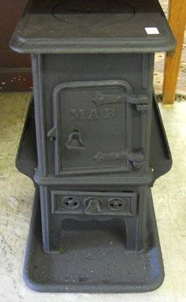 A quaint early 20thC Cast iron COAL STOVE