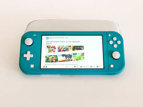 Nintendo Switch Lite (Turquoise) Including Carry Case, 64GB Memory Card & Official Charger Like New!