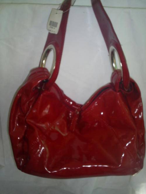 RED FASHION HANDBAG. NEW. BOUGHT IN CANADA.