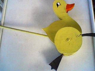 WOODEN WALKING DUCK. HAND MADE. WHEELS FOR FEET.