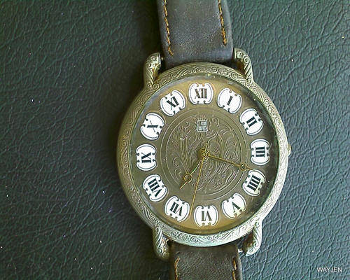 "WIN" MENS WATCH. NEEDS BATTERY. INSCRIBED ON REAR.