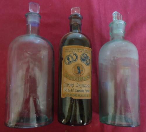 THREE DIFFERENT SIZE ROUND SHAPE CLEAR ICE BLUE GLASS VINTAGE CHEMIST / APOTHECARY BOTTLES W/ LABELS