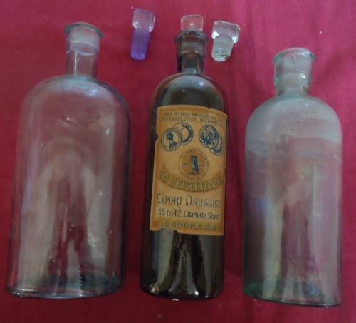 THREE DIFFERENT SIZE ROUND SHAPE CLEAR ICE BLUE GLASS VINTAGE CHEMIST / APOTHECARY BOTTLES W/ LABELS