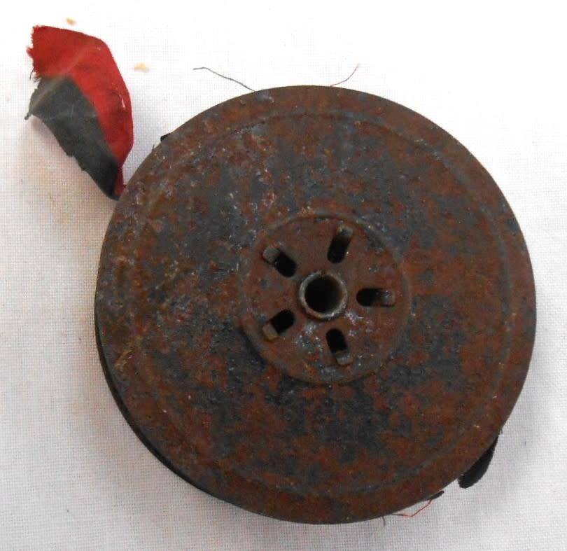 ONE TYPEWRITER REEL WITH OLD RED/BLACK RIBBON