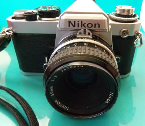 Nikon 1978 FE camera with 50 mm lens. Package-Vivitar 200 mm + 28 mm lenses and doubler in case.