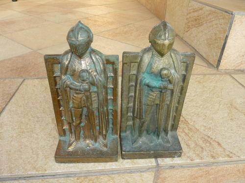 Four cast iron Knight door stoppers