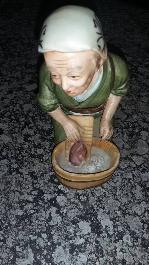 Statue of Japanese woman doing laundry