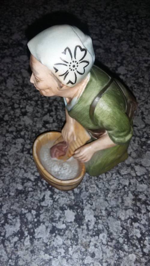 Statue of Japanese woman doing laundry