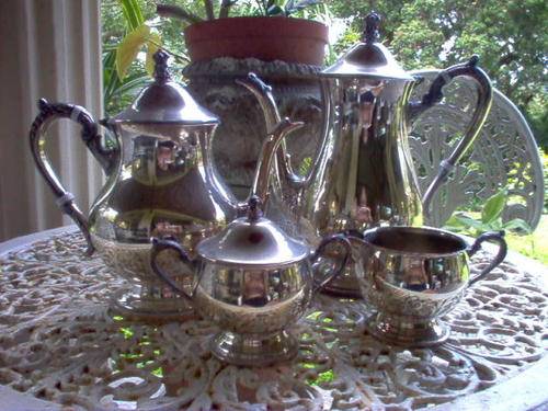 FOUR PIECE EM ESS SILVER PLATE TEA SET