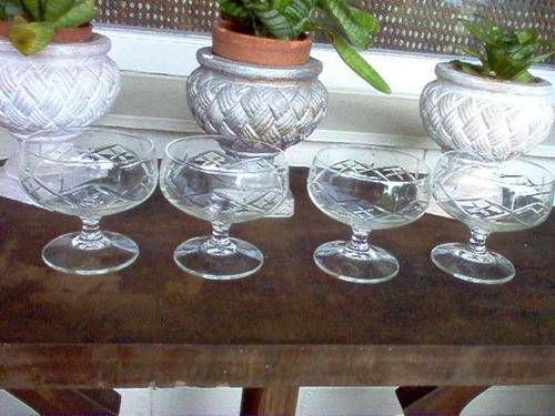 4 ELEGANT HAND CUT GLASS SWEET DISHES.