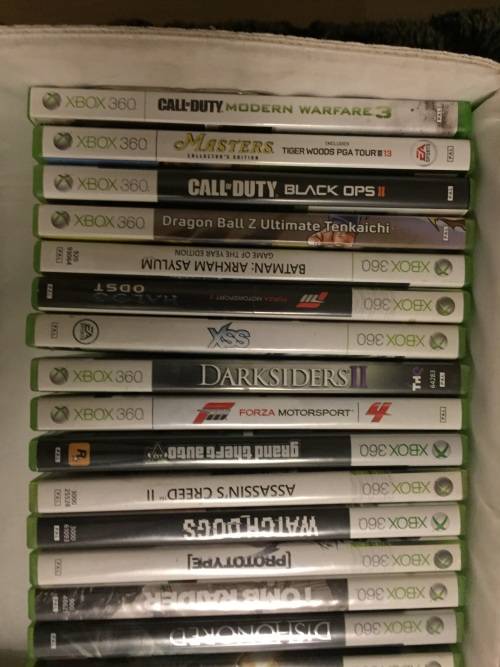 Xbox 360 slim 250G , 3 remotes , one charger , one steering wheel and 23 games