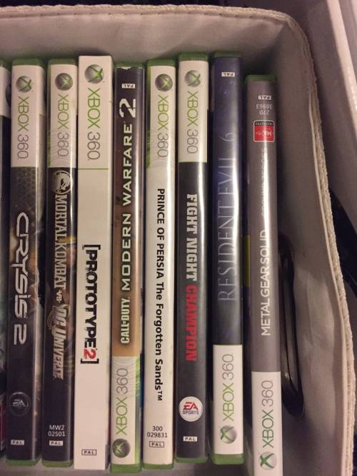 Xbox 360 slim 250G , 3 remotes , one charger , one steering wheel and 23 games