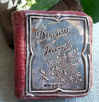 ANTIQUE MINIATURE DIARY WITH A HALL MARKED SILVER FRONT COVER DATED 1908