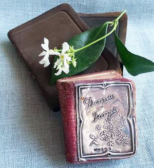 ANTIQUE MINIATURE DIARY WITH A HALL MARKED SILVER FRONT COVER DATED 1908