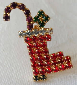 WISHING YOU A VERY, MERRY CHRISTMAS WITH THIS SPARKLING STOCKING BROOCH.