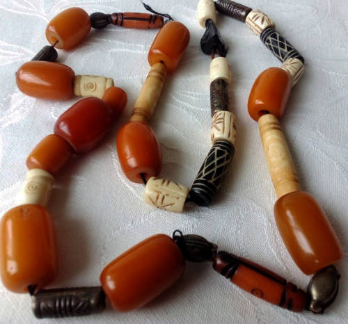 UPCYCLED  BEAD NECKLACE, USING 11 VINTAGE BUTTERSCOTCH BAKELITE BEADS, BONE, AND METAL