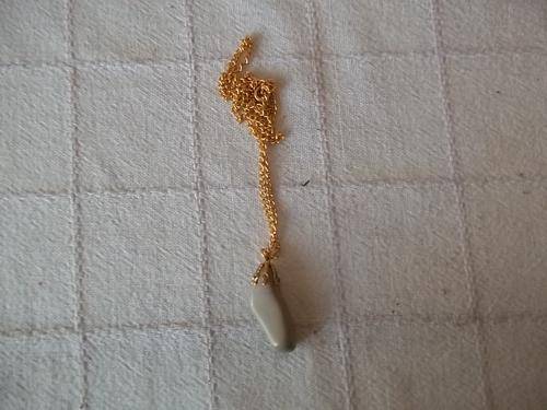 necklace, sand colour stone on gold chain
