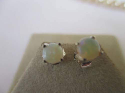 A Pair of Sterling Silver and Australian Opals Earrings