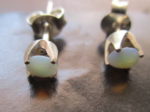 A Pair of Sterling Silver and Australian Opals Earrings