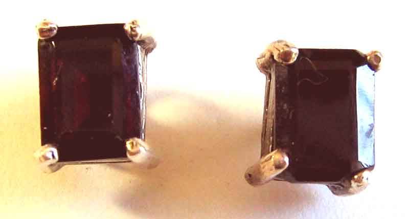 A pair of Sterling Silver and Genuine Garnets Earrings- Studs.