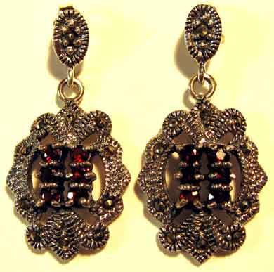 PRETTY, A PAIR OF SOLID SILVER, MARCASITE AND GARNETS  EARRINGS.