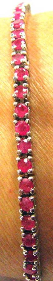 Sterling Silver and Genuine Rubies Tennis Bracelet.