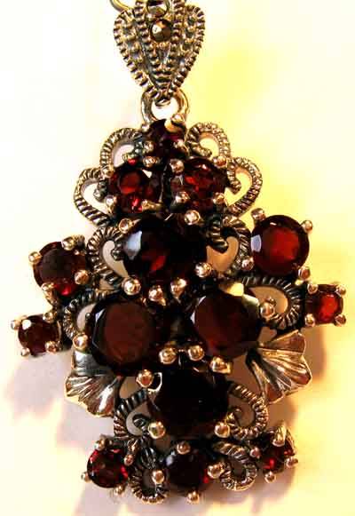 Pretty Sterling Silver, Marcasite and Garnets Pendant.