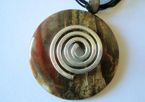 Autumn Agate Pi Stone on circle of life bail.