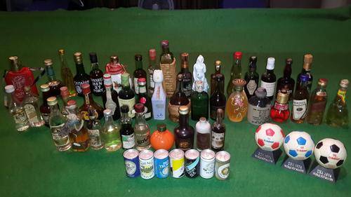 A collection of 55 old miniature alcohol bottles and beer cans