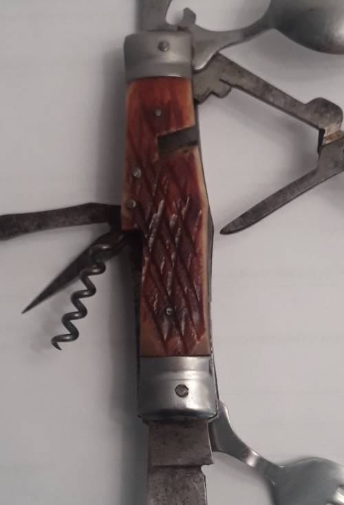 A  vintage multi-tool utility knife with original pouch.  Awesome!!!