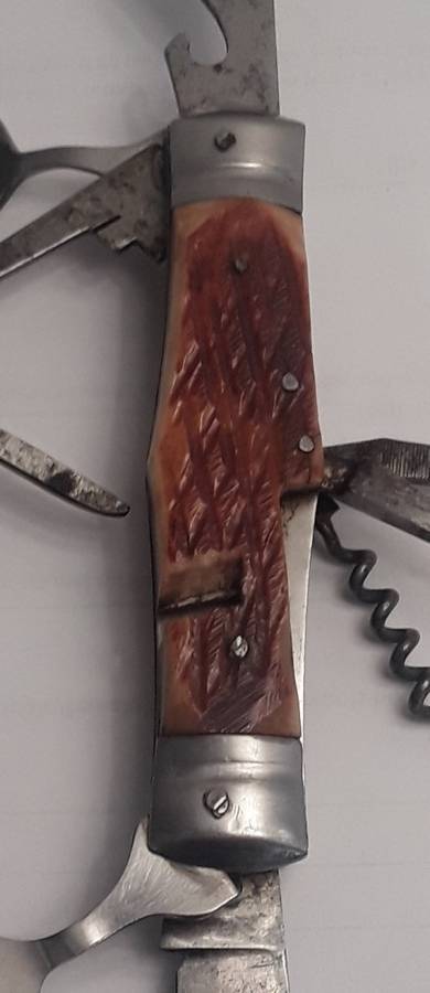 A  vintage multi-tool utility knife with original pouch.  Awesome!!!