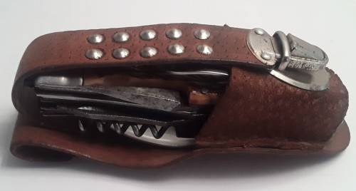 A  vintage multi-tool utility knife with original pouch.  Awesome!!!