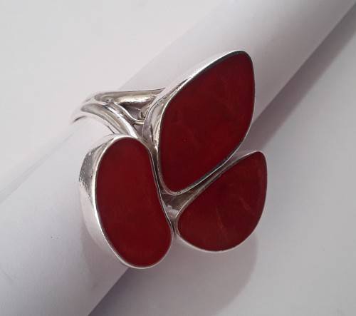 A beautifully designed, sterling silver ring with stunning red stones.  Wow!!!