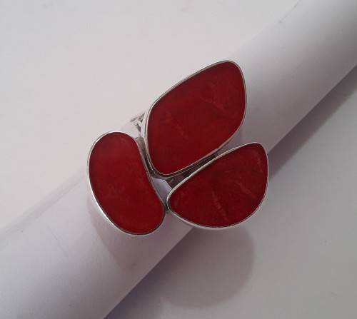 A beautifully designed, sterling silver ring with stunning red stones.  Wow!!!