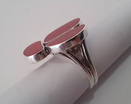 A beautifully designed, sterling silver ring with stunning red stones.  Wow!!!