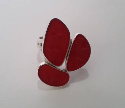 A beautifully designed, sterling silver ring with stunning red stones.  Wow!!!