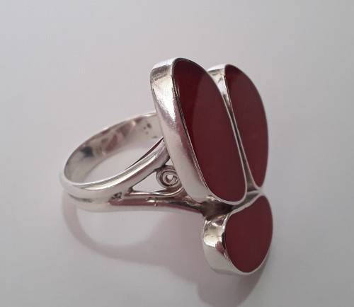 A beautifully designed, sterling silver ring with stunning red stones.  Wow!!!