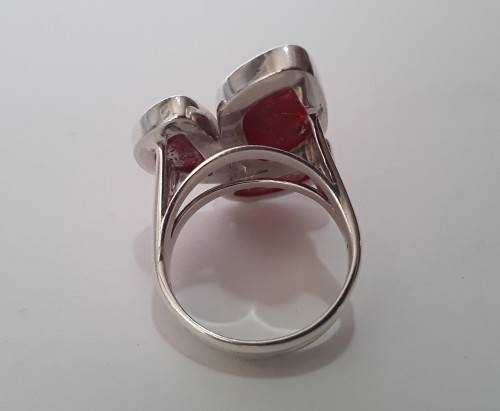 A beautifully designed, sterling silver ring with stunning red stones.  Wow!!!