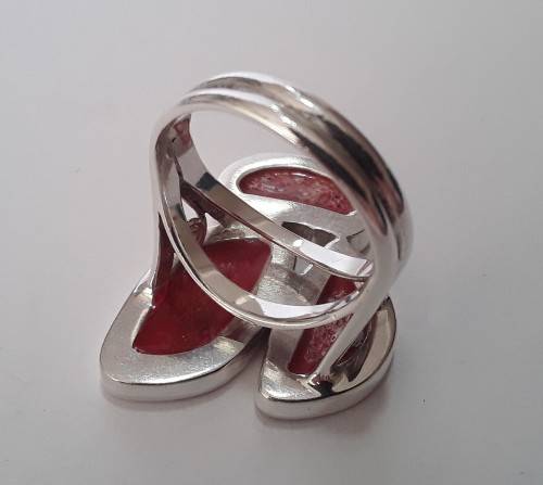 A beautifully designed, sterling silver ring with stunning red stones.  Wow!!!