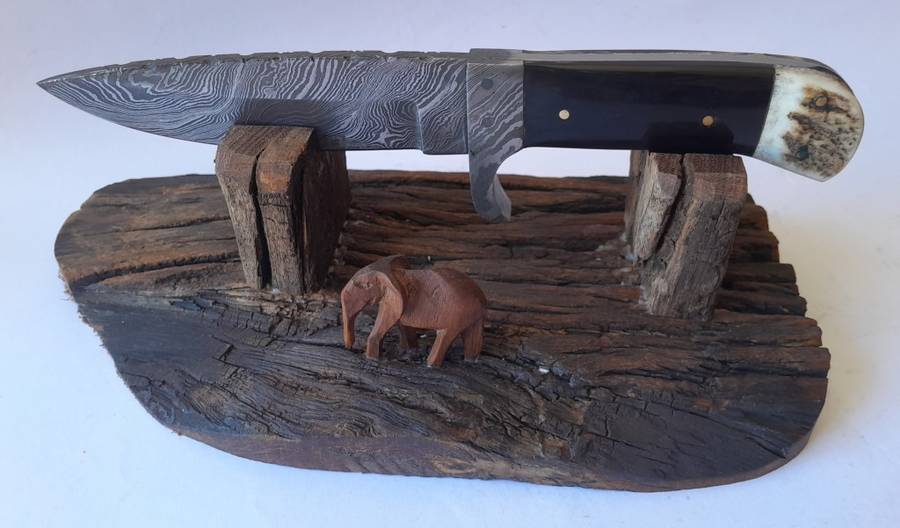 A Superb Damascus Blade Hunting Knife With Leather Sheath And Display Stand.