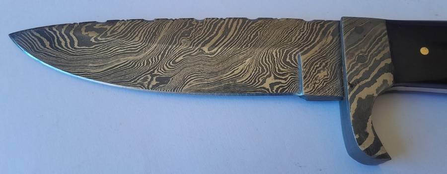 A Superb Damascus Blade Hunting Knife With Leather Sheath And Display Stand.