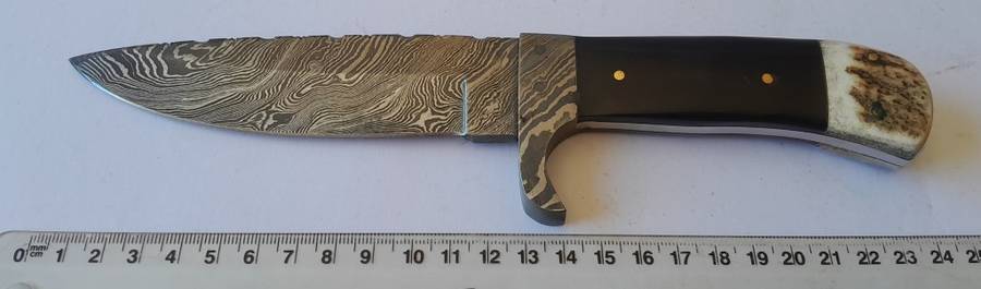 A Superb Damascus Blade Hunting Knife With Leather Sheath And Display Stand.