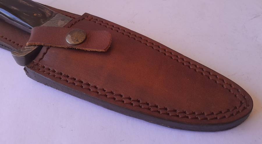 A Superb Damascus Blade Hunting Knife With Leather Sheath And Display Stand.