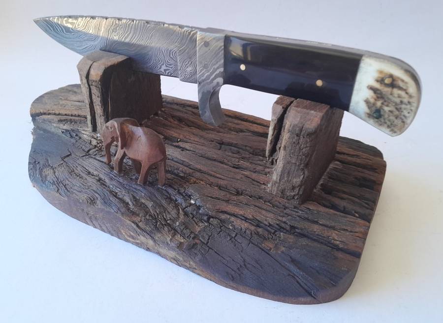 A Superb Damascus Blade Hunting Knife With Leather Sheath And Display Stand.